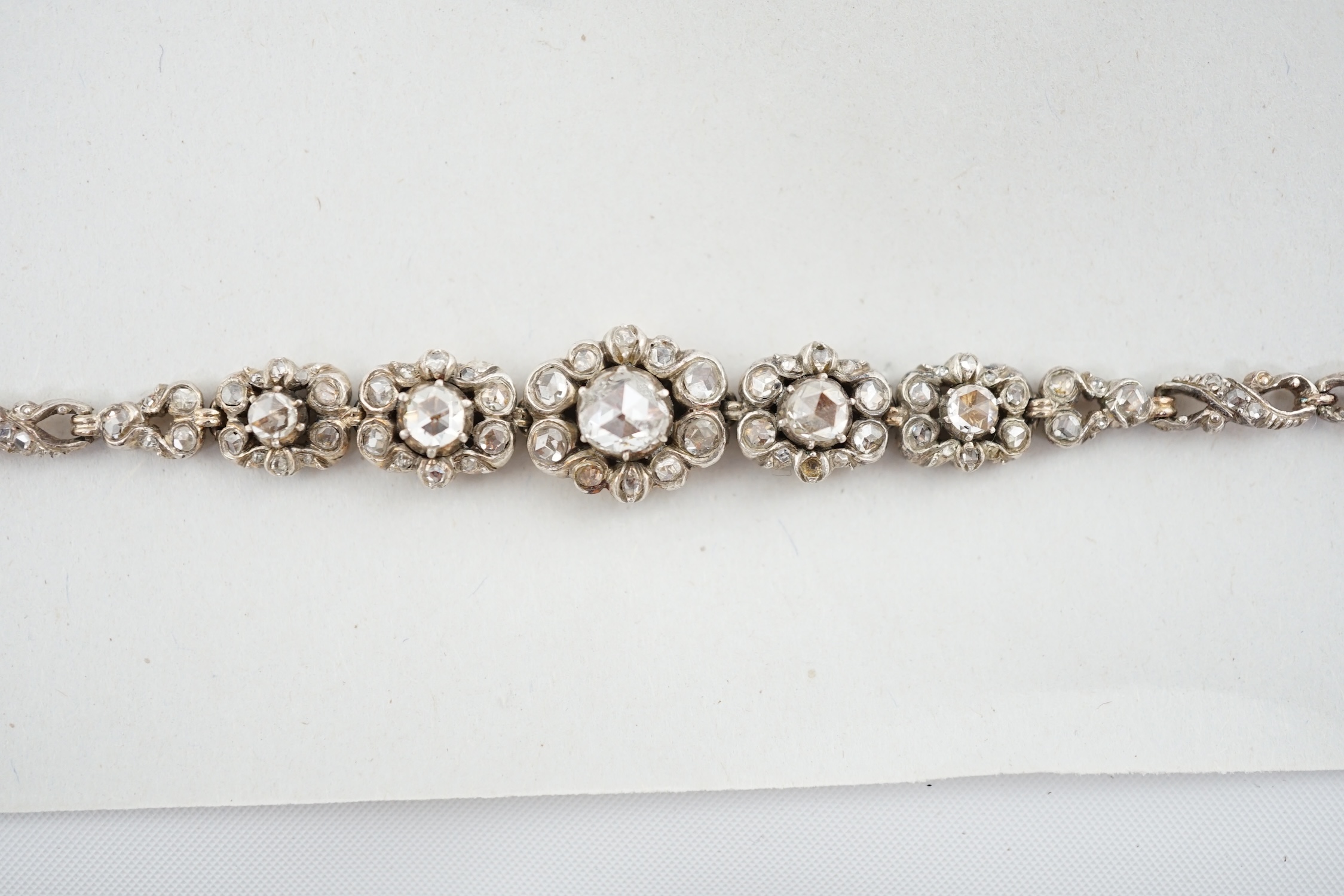 An early 20th century continental 14k gold and rose cut diamond cluster set bracelet